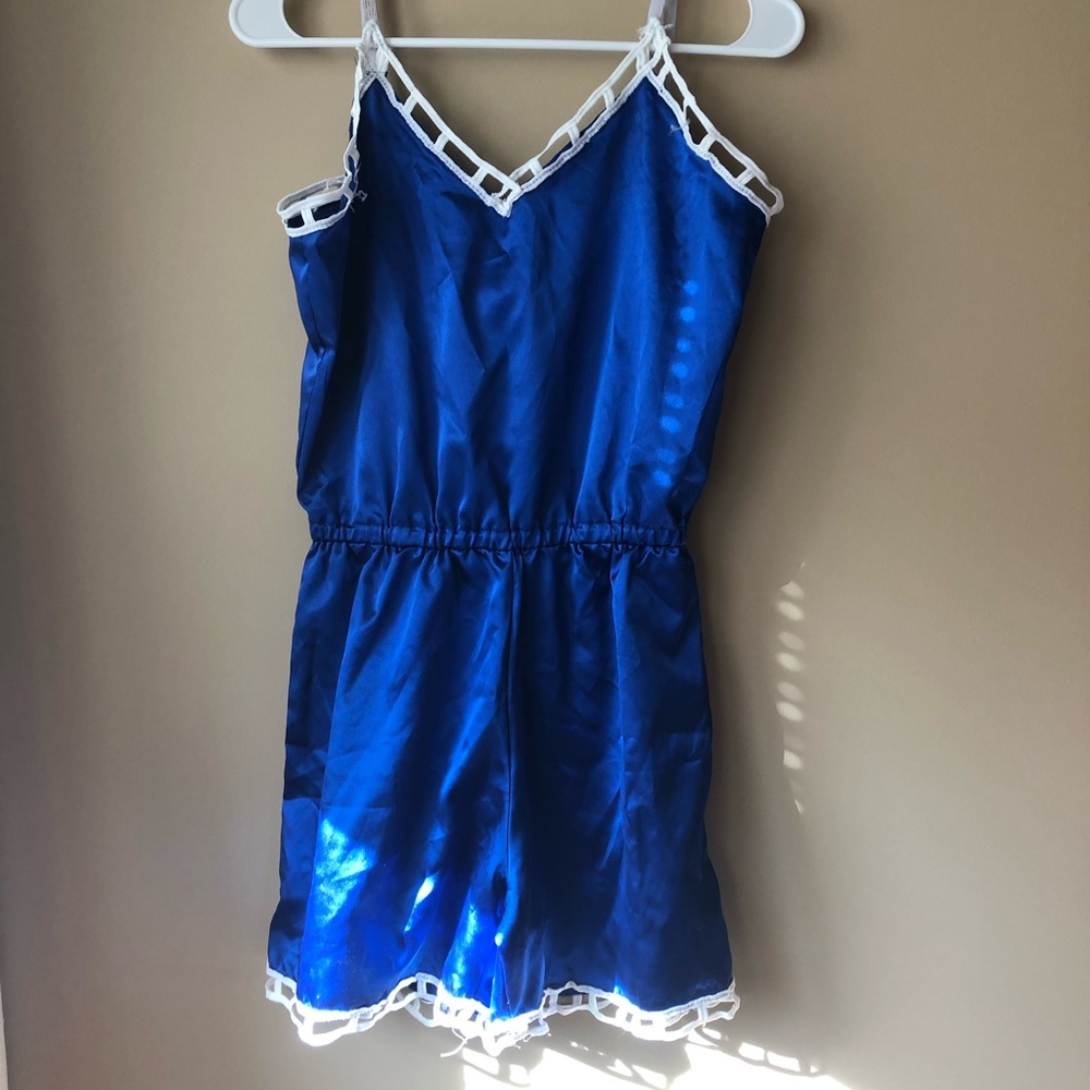 Blue romper with white trim